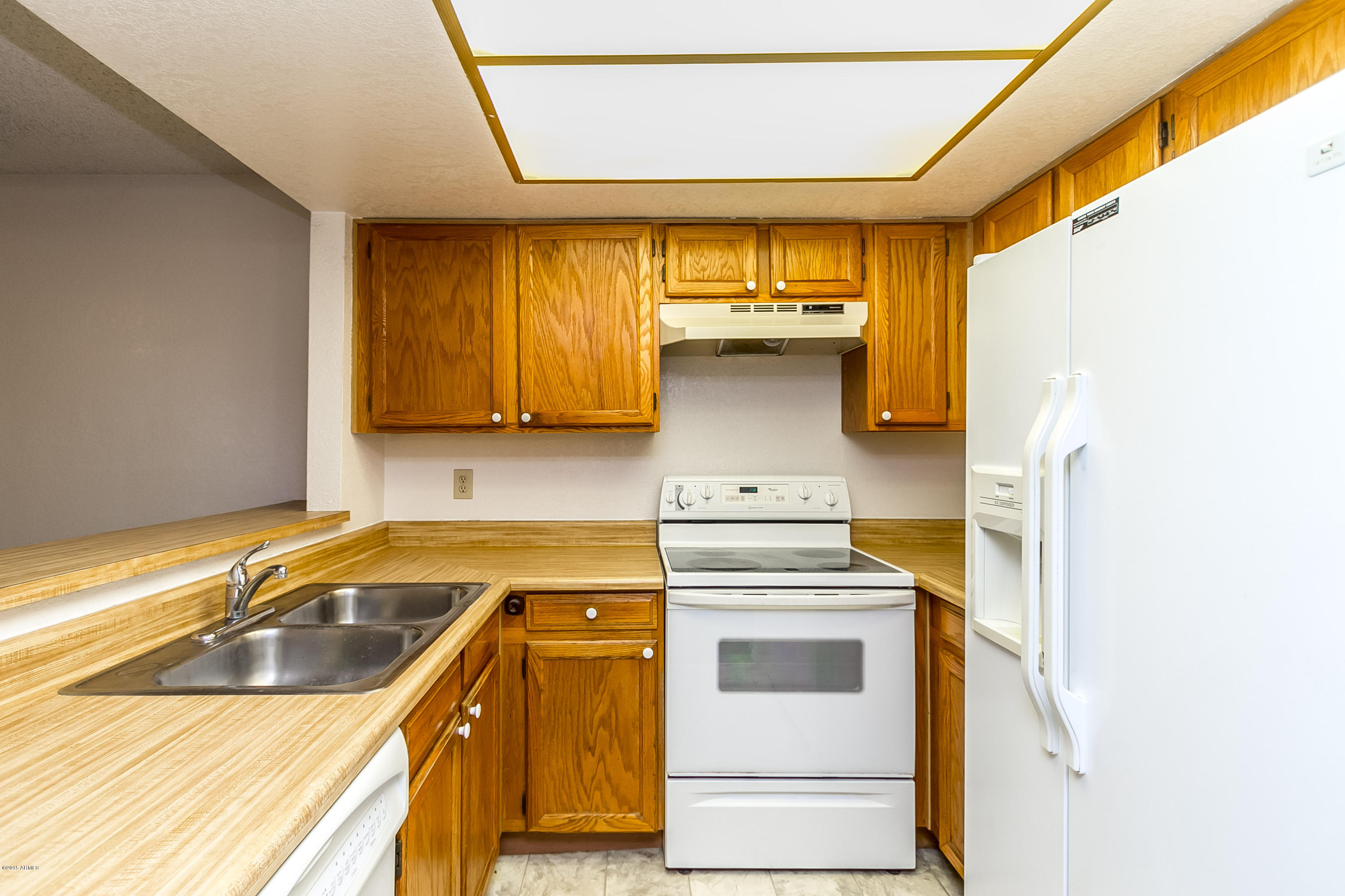 1645 West Baseline Road, Unit 1160 Mesa, AZ 85202 - Photo 7 of 27 a kitchen with a sink and cabinets