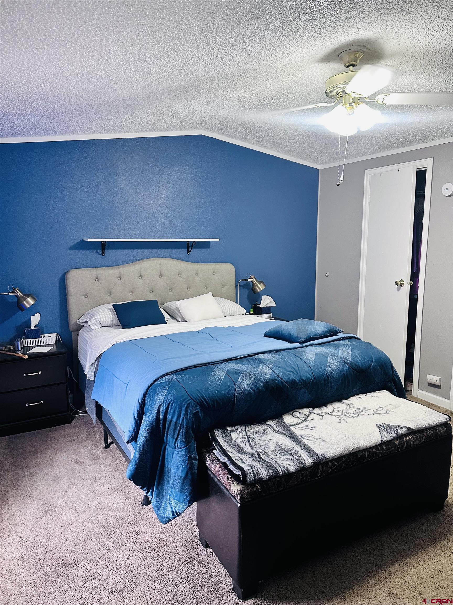 62880 Lasalle Road, Unit 174 Montrose, CO 81401 - Photo 16 of 23 a bedroom with a bed and a dresser