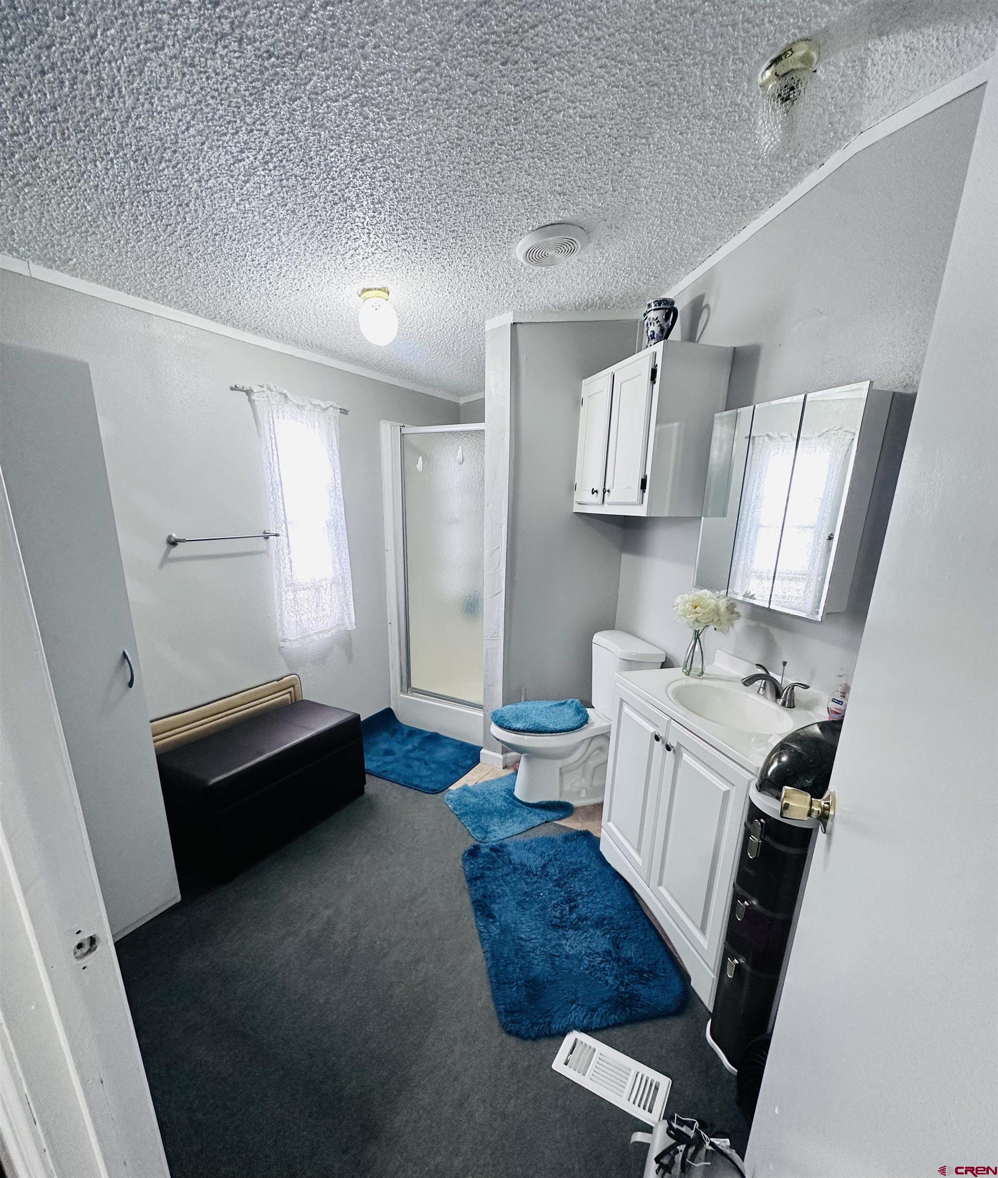 62880 Lasalle Road, Unit 174 Montrose, CO 81401 - Photo 19 of 23 a kitchen with a refrigerator and a stove top oven