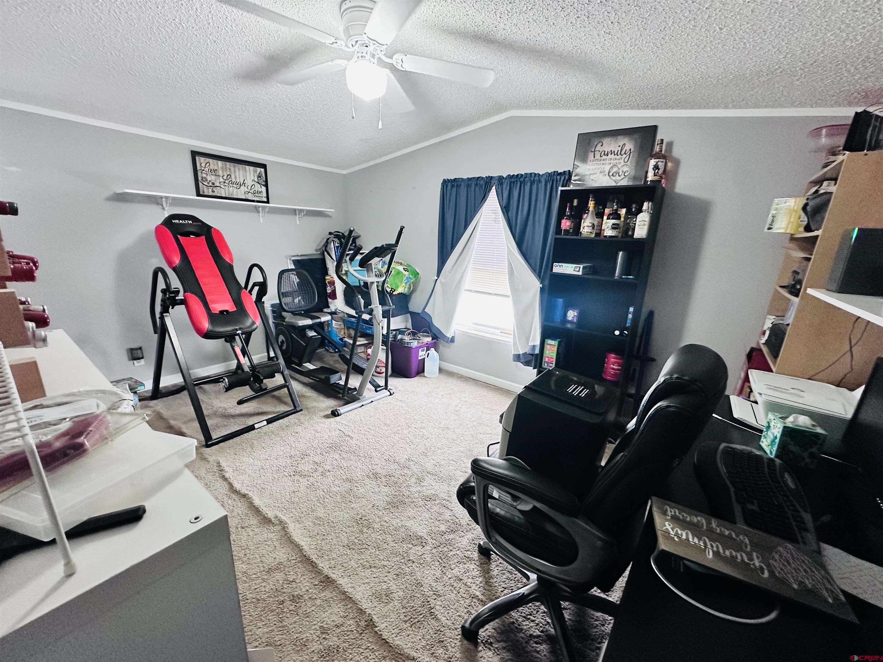 62880 Lasalle Road, Unit 174 Montrose, CO 81401 - Photo 20 of 23 a living room with furniture a air conditioner and a window