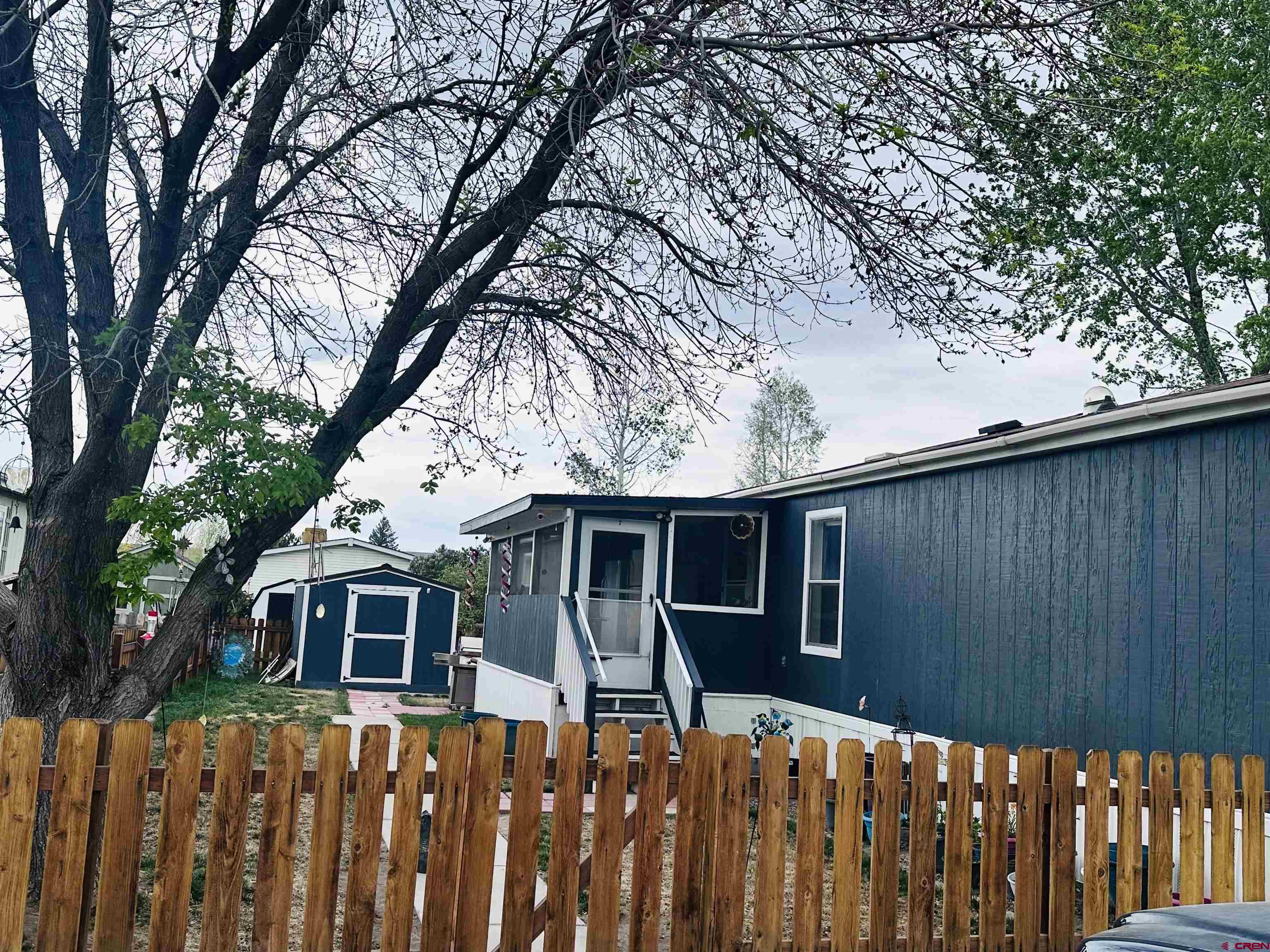 62880 Lasalle Road, Unit 174 Montrose, CO 81401 - Photo 2 of 23 a house view with a backyard space