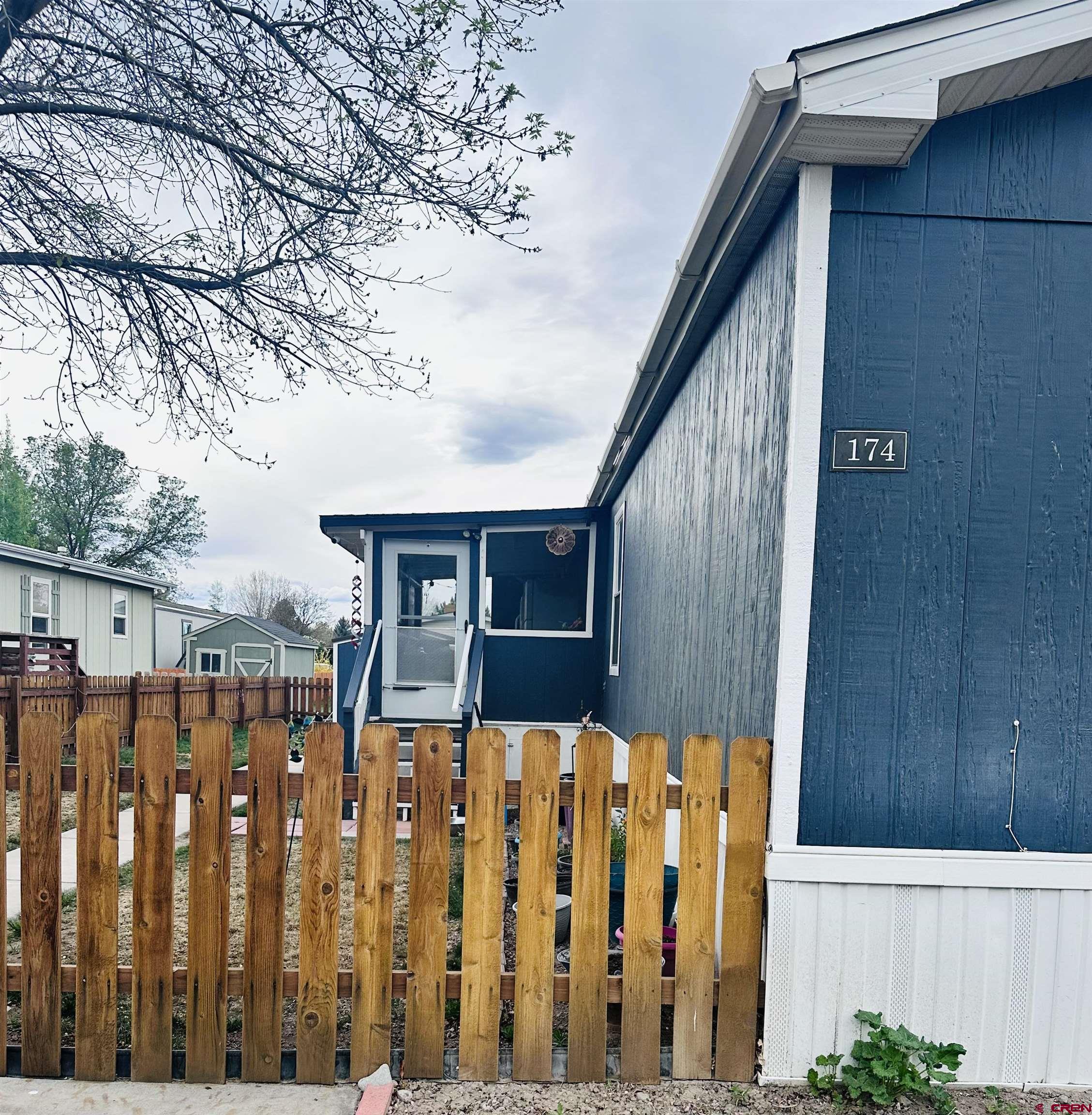 62880 Lasalle Road, Unit 174 Montrose, CO 81401 - Photo 3 of 23 a view of wooden fence
