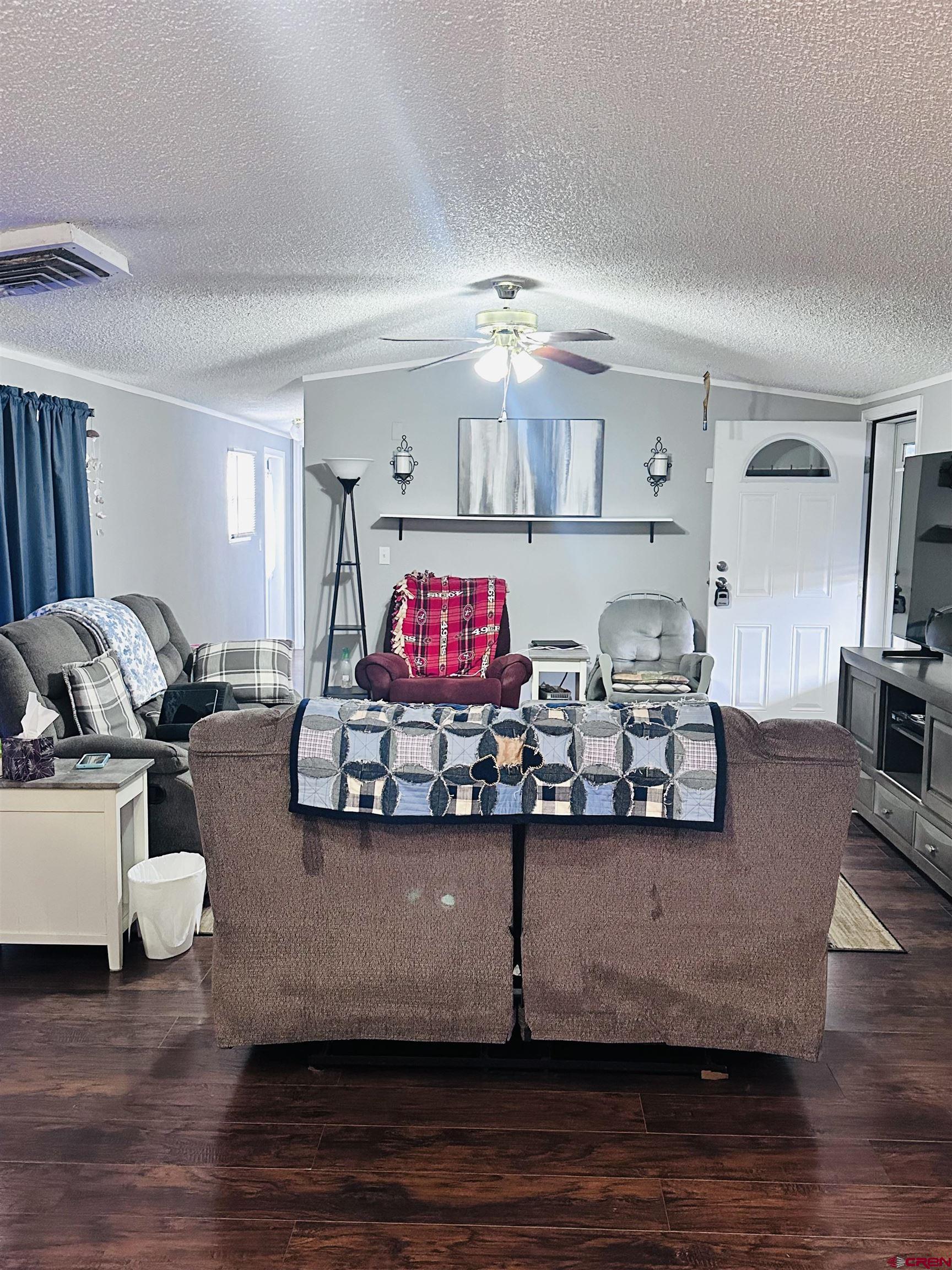 62880 Lasalle Road, Unit 174 Montrose, CO 81401 - Photo 7 of 23 a view of a living room and chandelier