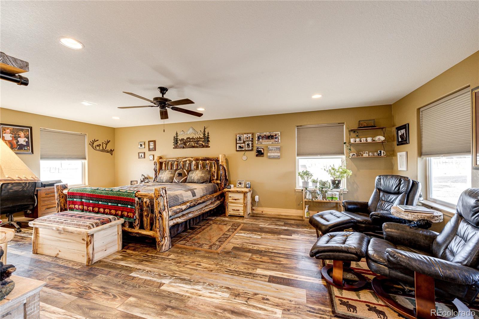 3955 South Behrens Road Byers, CO 80103 - Photo 13 of 32 a bedroom with furniture and a window