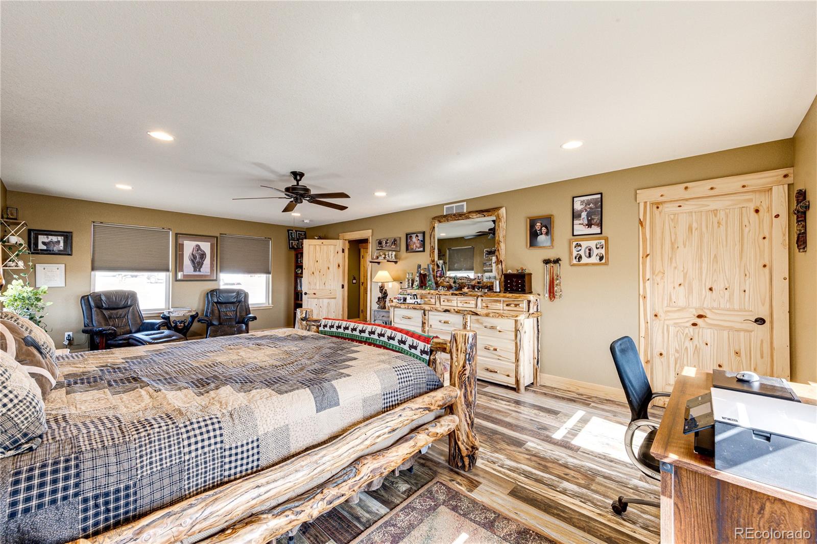 3955 South Behrens Road Byers, CO 80103 - Photo 14 of 32 a bedroom with furniture and a bed