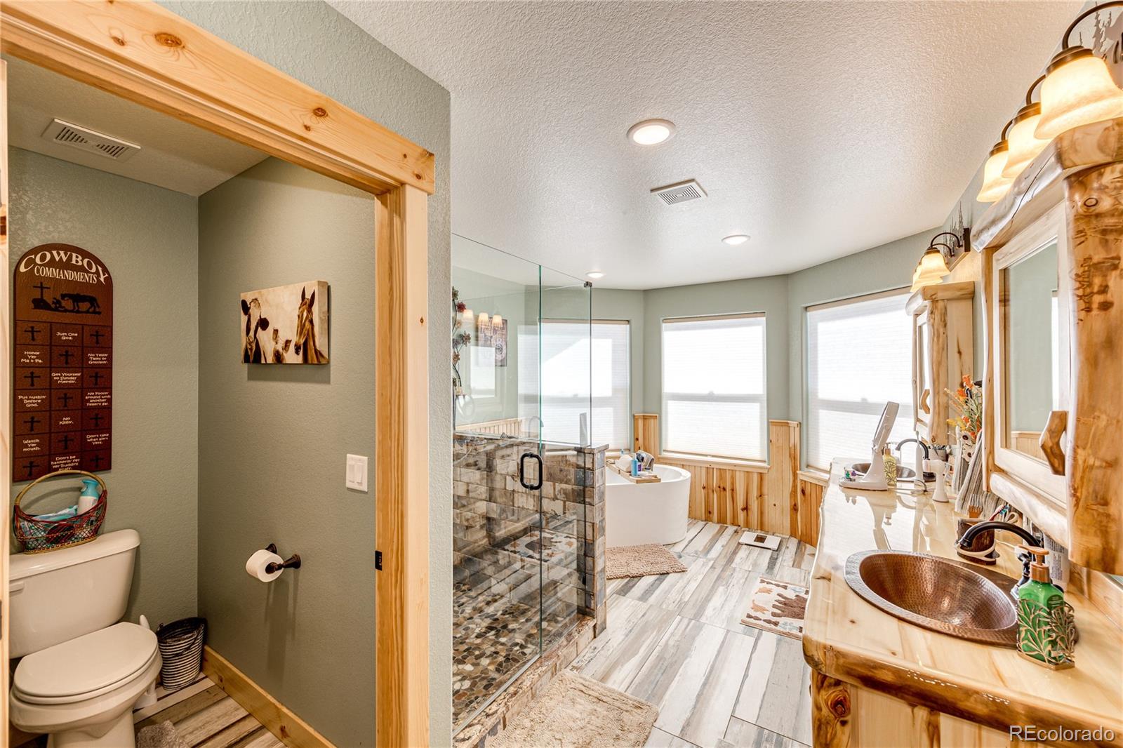 3955 South Behrens Road Byers, CO 80103 - Photo 17 of 32 a living room with furniture and a large window