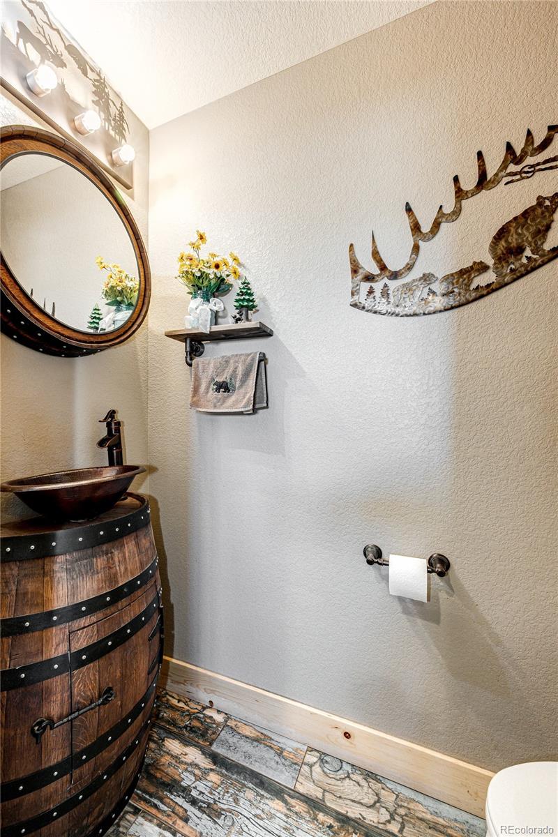 3955 South Behrens Road Byers, CO 80103 - Photo 19 of 32 a room with storage and utility racks