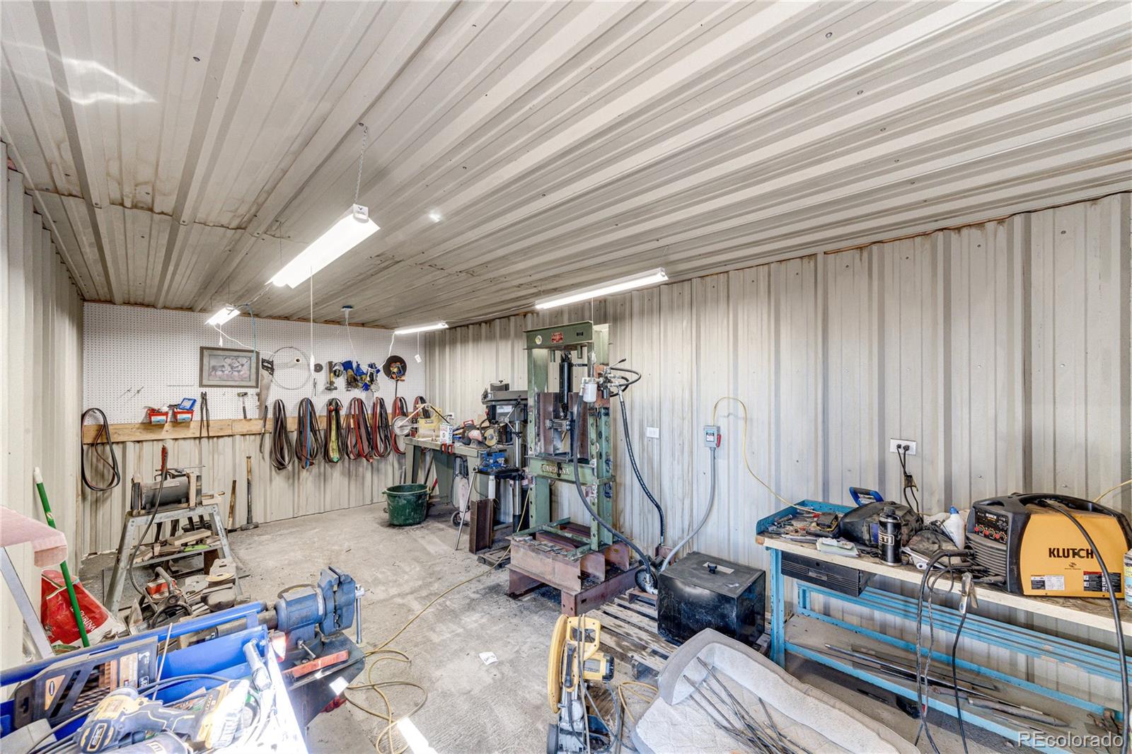 3955 South Behrens Road Byers, CO 80103 - Photo 29 of 32 a view of a room with gym equipment