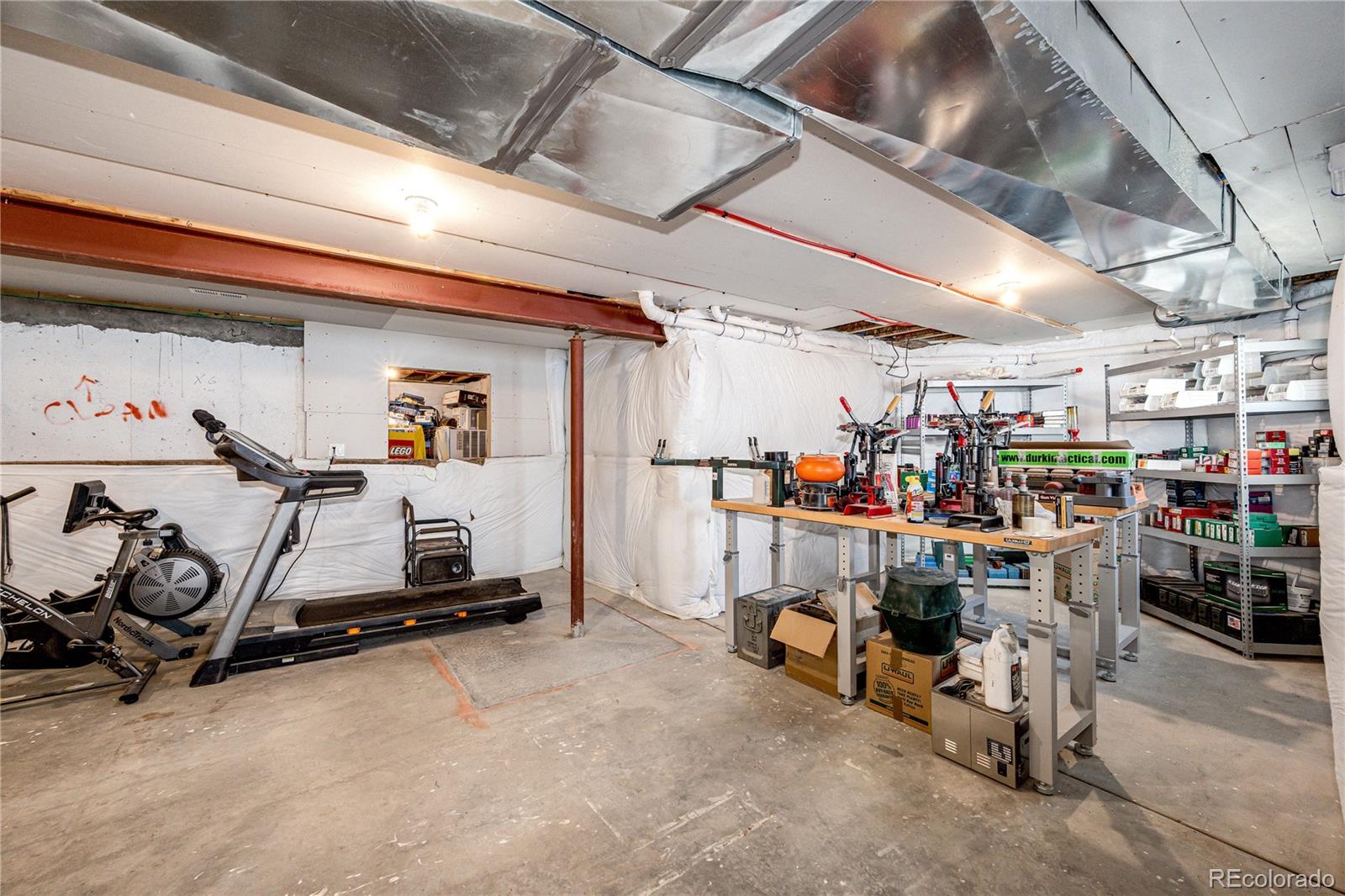 3955 South Behrens Road Byers, CO 80103 - Photo 30 of 32 a view of storage and utility room