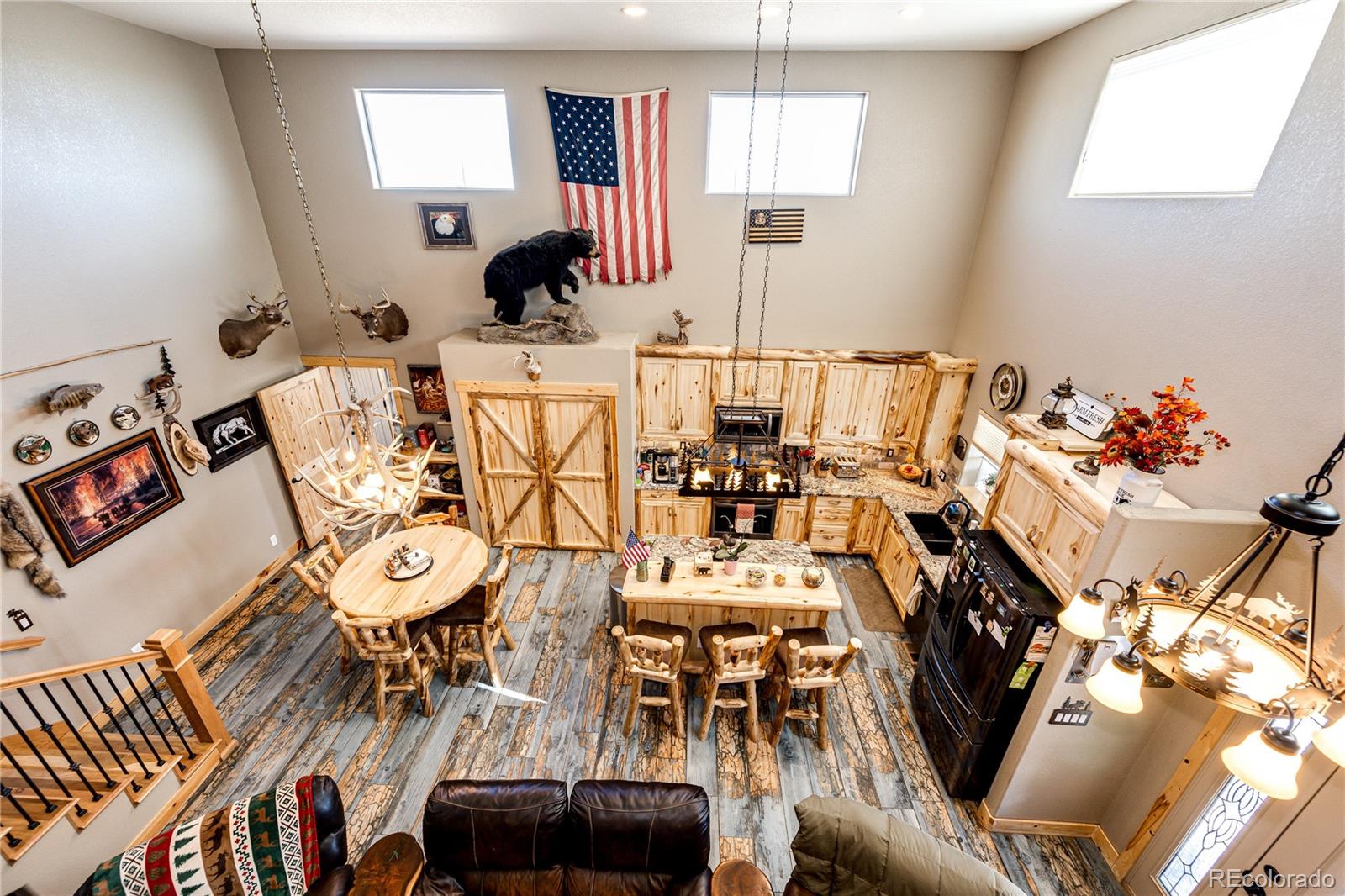3955 South Behrens Road Byers, CO 80103 - Photo 9 of 32 a living room with furniture and wooden floor