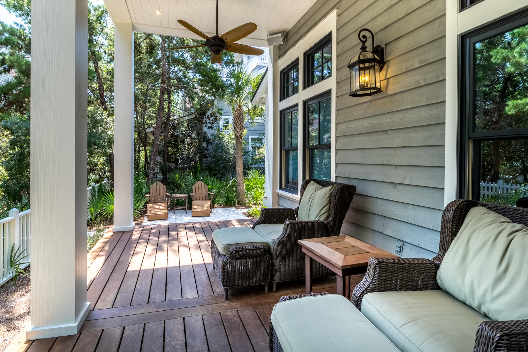 52 North Shingle Way Inlet Beach, FL 32461 - Photo 11 of 49 a view of a patio with couches chairs potted plants and wooden floor