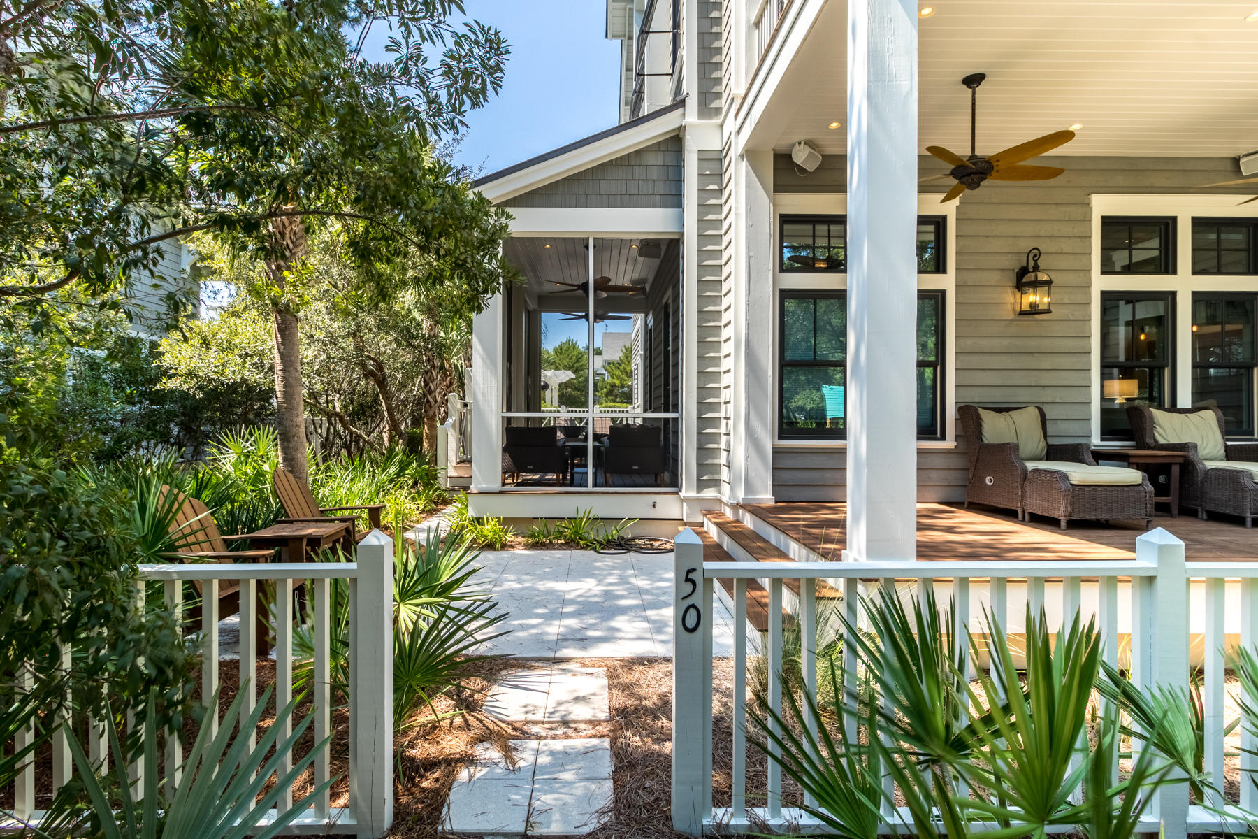 52 North Shingle Way Inlet Beach, FL 32461 - Photo 12 of 49 front view of house with a yard glass top table and chairs