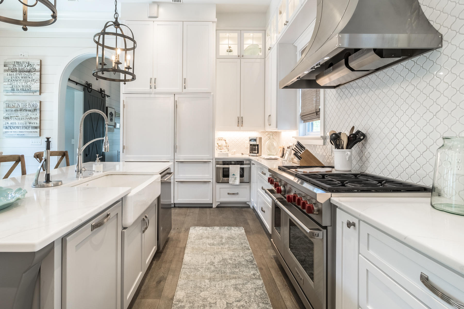 52 North Shingle Way Inlet Beach, FL 32461 - Photo 7 of 49 a kitchen with stainless steel appliances a sink stove and cabinets