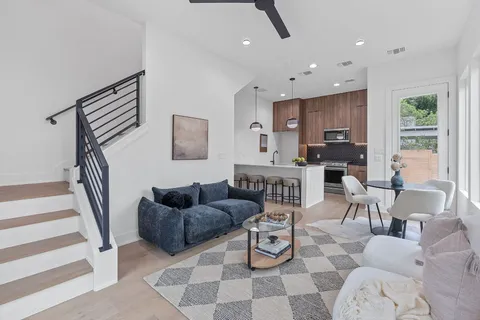 a living room with furniture and a rug
