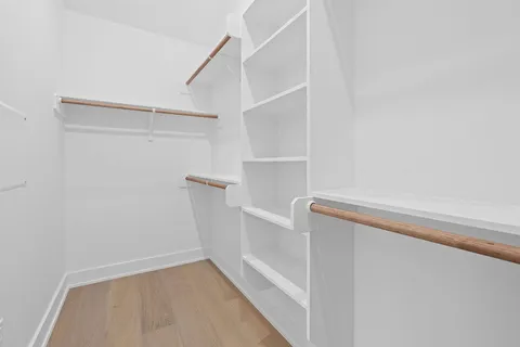 a view of an empty walk in closet