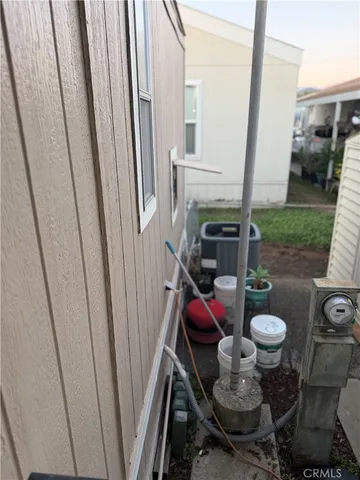a view of a room with furniture and a floor to ceiling window