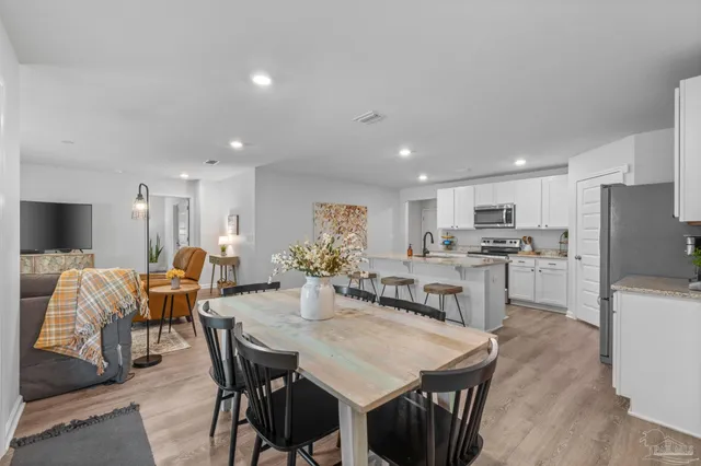 a view of a dining room with furniture