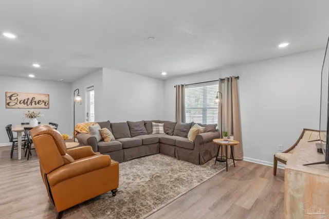 a living room with furniture and a window
