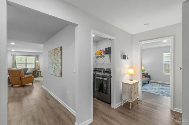 a view of a livingroom with furniture and wooden floor