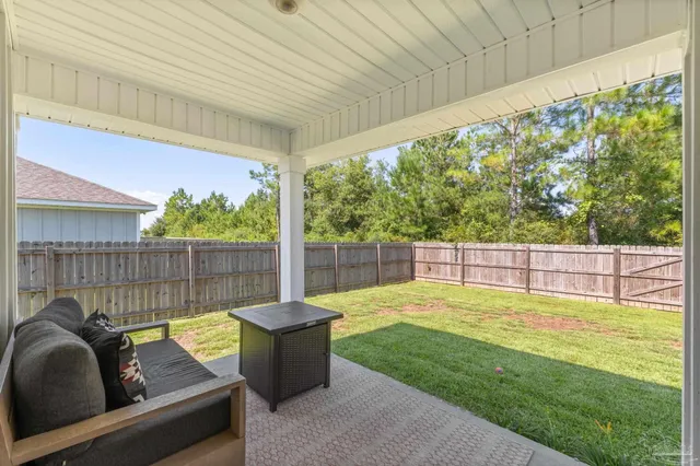 a view of a backyard with a small pool