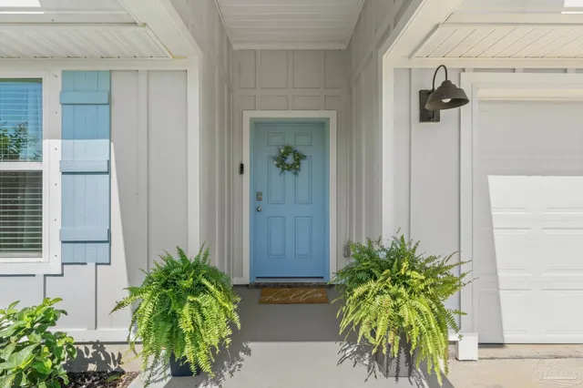a potted plant sitting in front of a house