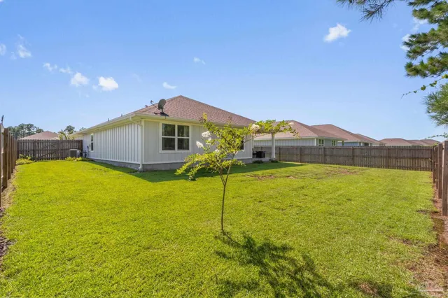 a house view with swimming pool