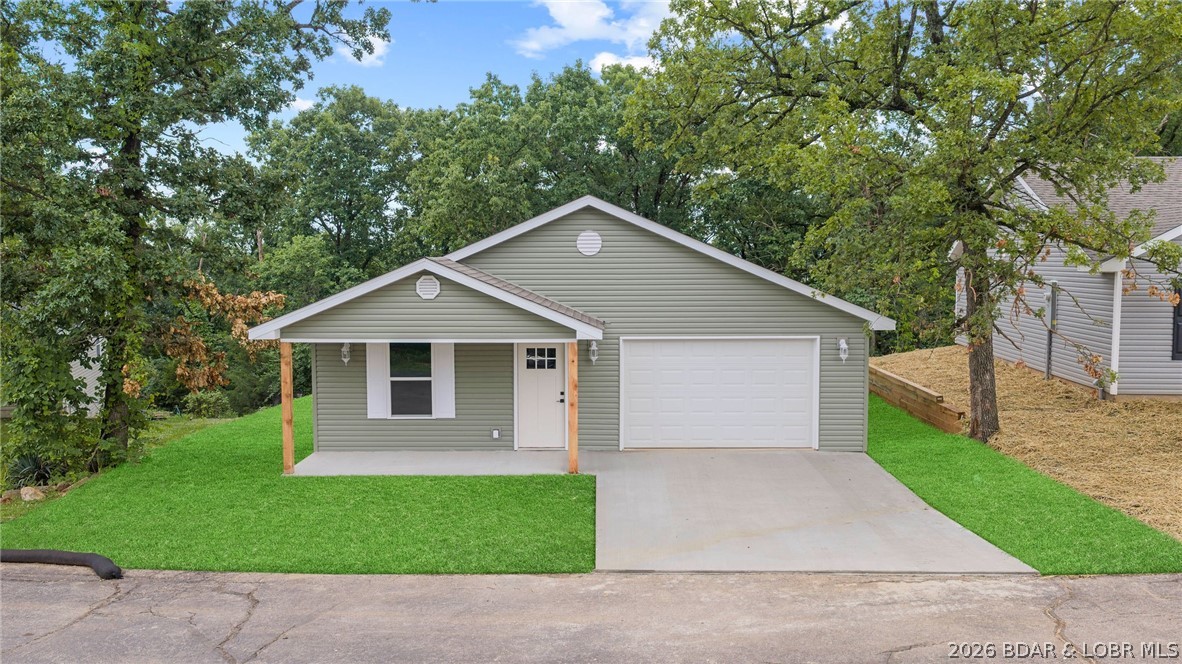 56 Walnut Court Eldon, MO 65026 - Photo 37 of 50 Virtually staged grass