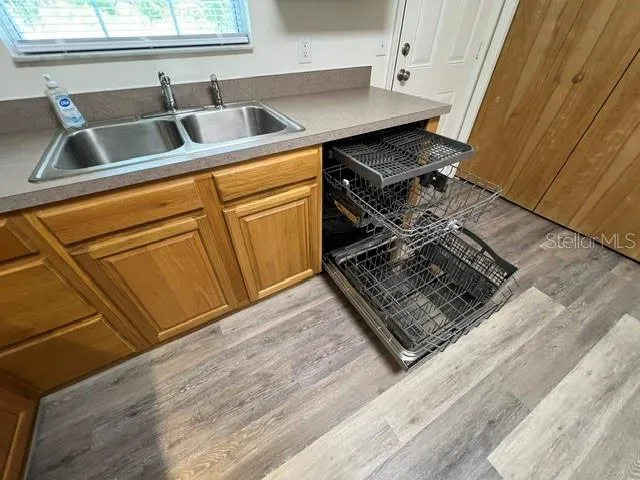 a stove top oven sitting inside of a kitchen