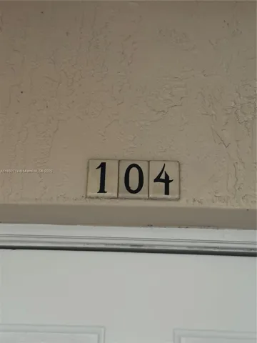 a view of a house with a sink and flower plants