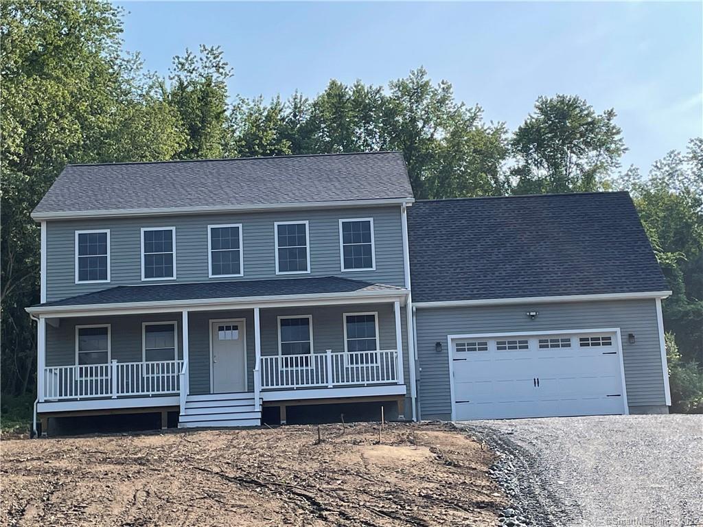 136 Pond Road Franklin, CT 06254 - Photo 1 of 1 a front view of a house with a garden