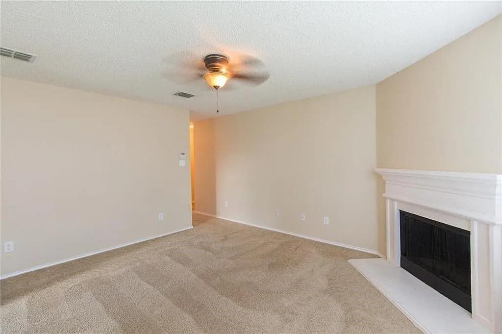 118 Scarlet View Anna, TX 75409 - Photo 7 of 16 a view of an empty room with a fireplace