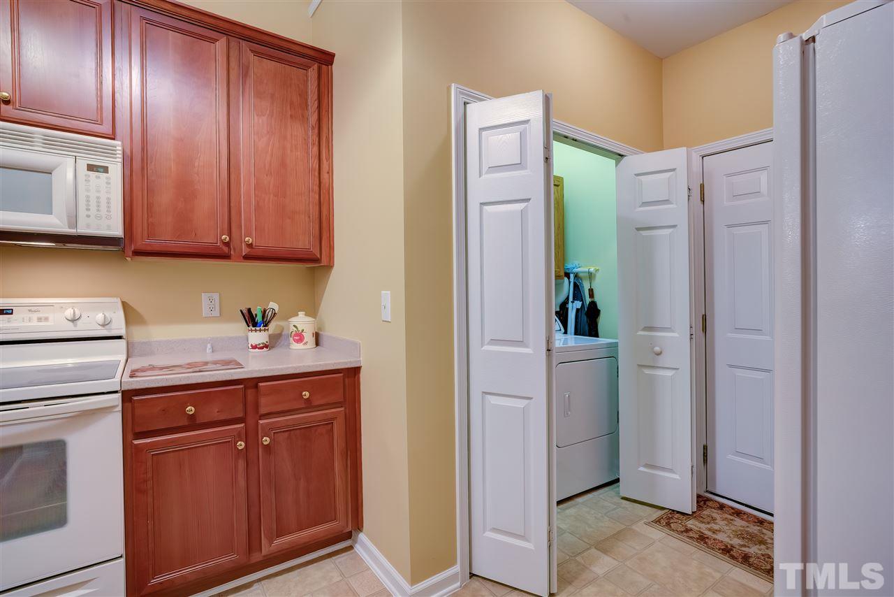 10305 Dapping Drive Raleigh, NC 27614 - Photo 14 of 30 a room with cabinets and washer