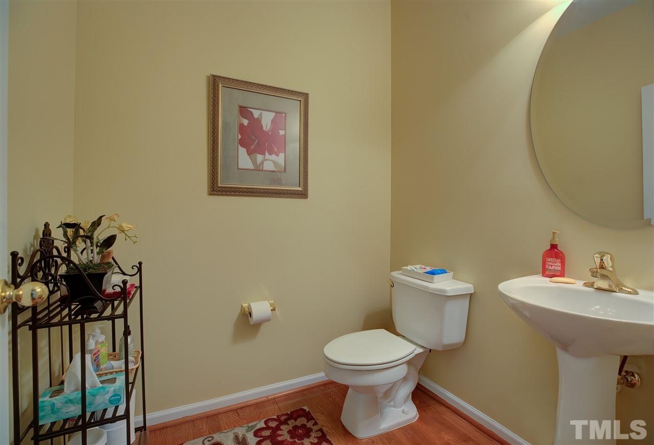 10305 Dapping Drive Raleigh, NC 27614 - Photo 21 of 30 a bathroom with a toilet sink and mirror
