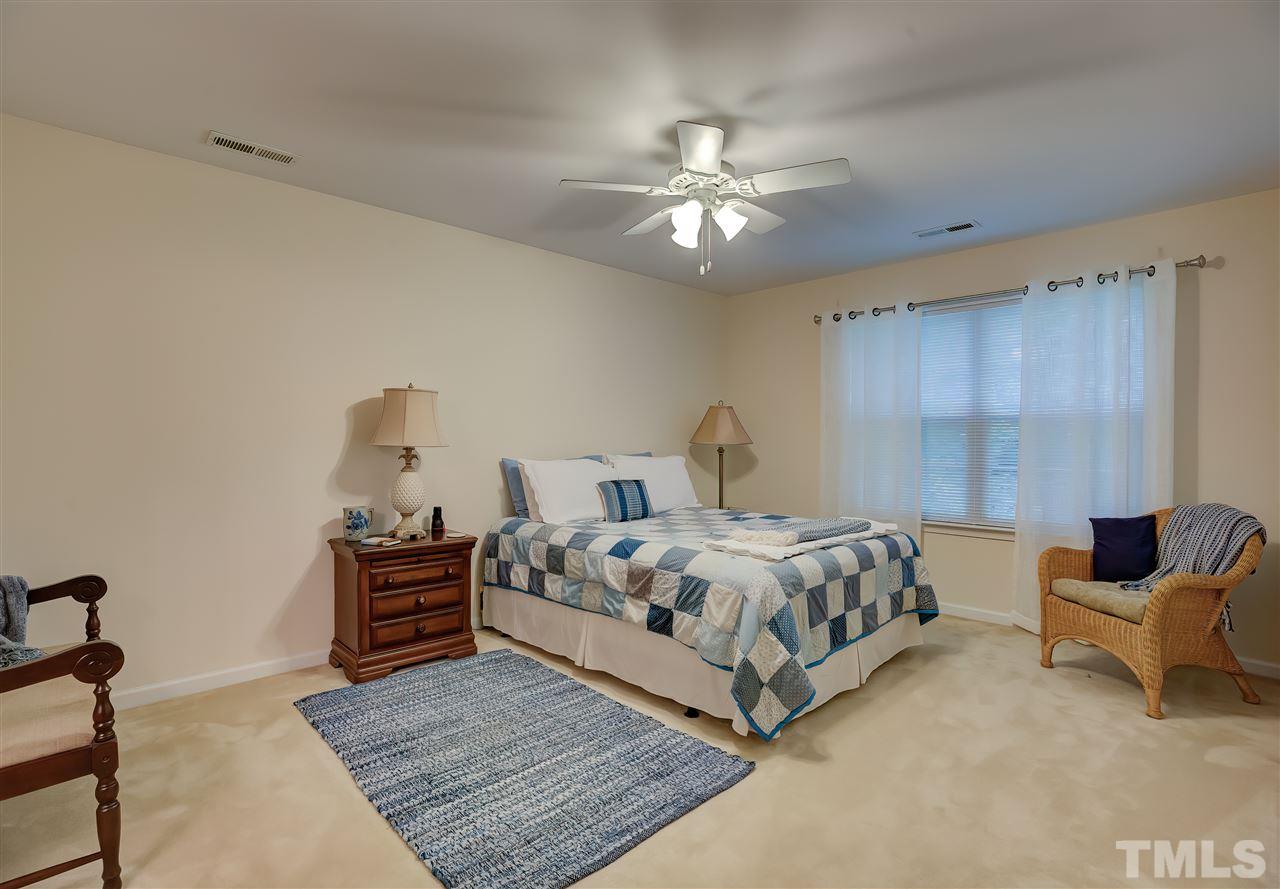 10305 Dapping Drive Raleigh, NC 27614 - Photo 22 of 30 a bedroom with a bed and window
