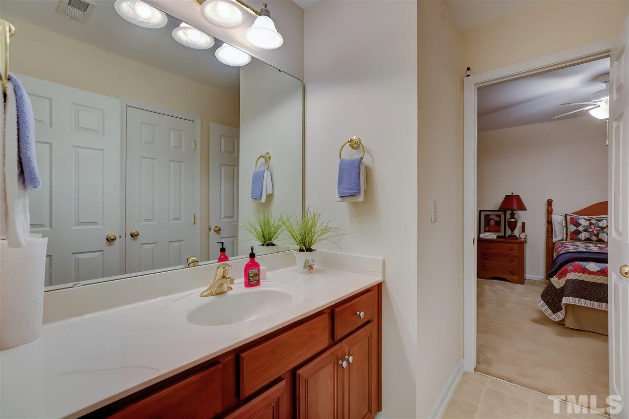 10305 Dapping Drive Raleigh, NC 27614 - Photo 24 of 30 a en suite bathroom with a sink and a mirror