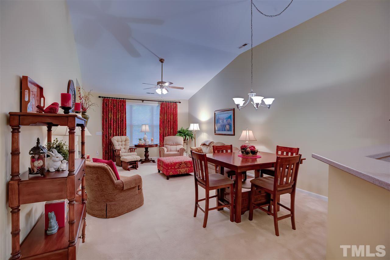 10305 Dapping Drive Raleigh, NC 27614 - Photo 7 of 30 a view of a dining room with furniture and chandelier