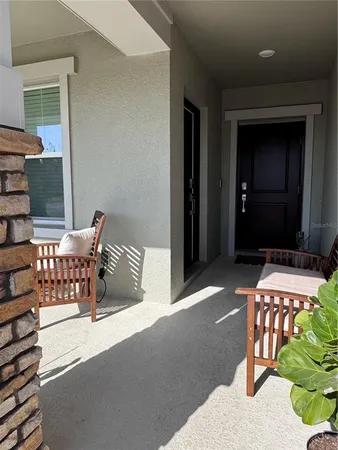 a balcony view with a outdoor seating space