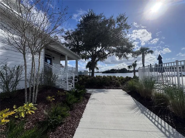 a view of a pathway with a wrought fence