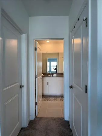 a view of a hallway view with wooden floor and staircase