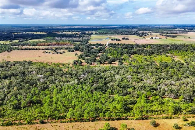 a view of a large body of water with a building in the background