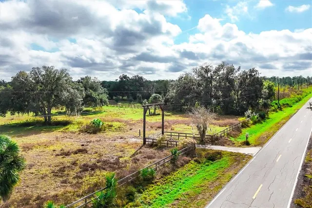 a view of a swimming pool with a yard