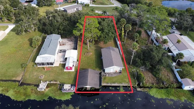 an aerial view of residential house with outdoor space and swimming pool