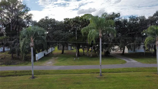 a backyard of a house with lots of green space