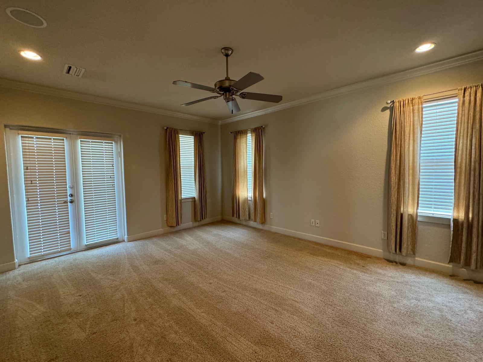241 Inverrary Drive Destin, FL 32541 - Photo 9 of 24 a view of a livingroom with a ceiling fan and window