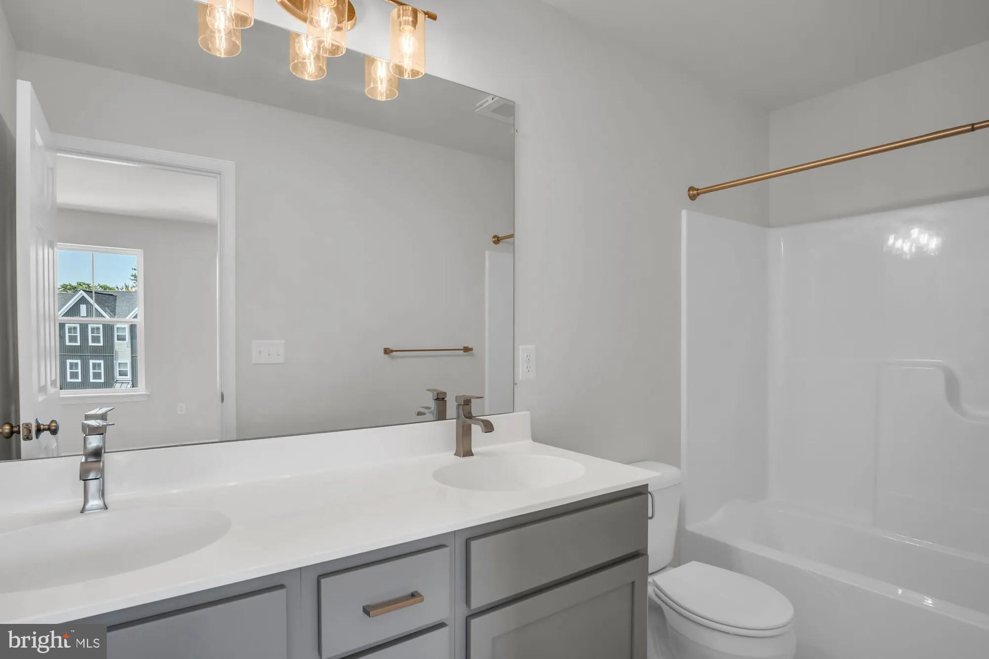 4 Morgan Circle, Unit 1303 Carlisle, PA 17013 - Photo 12 of 13 a bathroom with a sink a toilet and shower