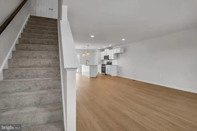 a view of wooden floor and windows in a room