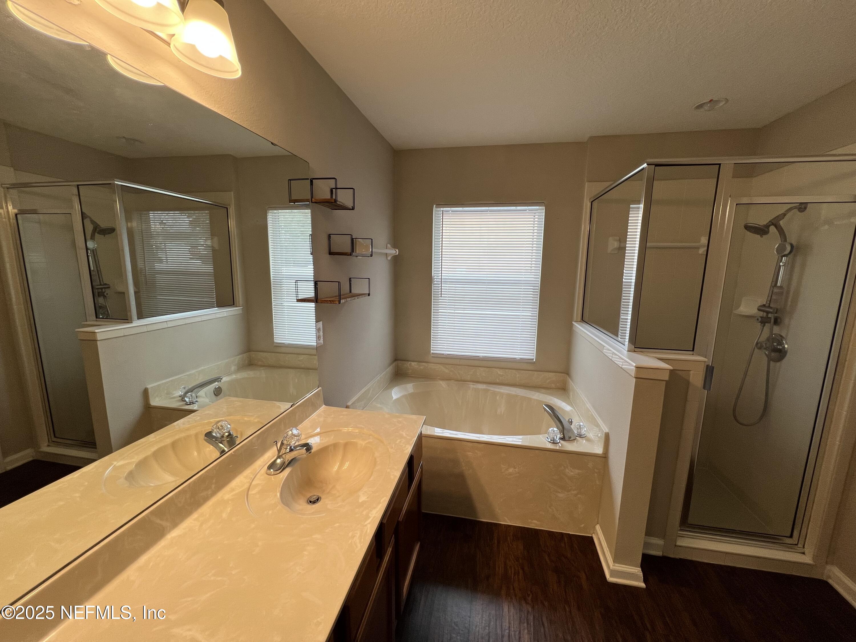 1960 McGirts Point Boulevard Jacksonville, FL 32221 - Photo 14 of 18 a room with a window and wooden floor