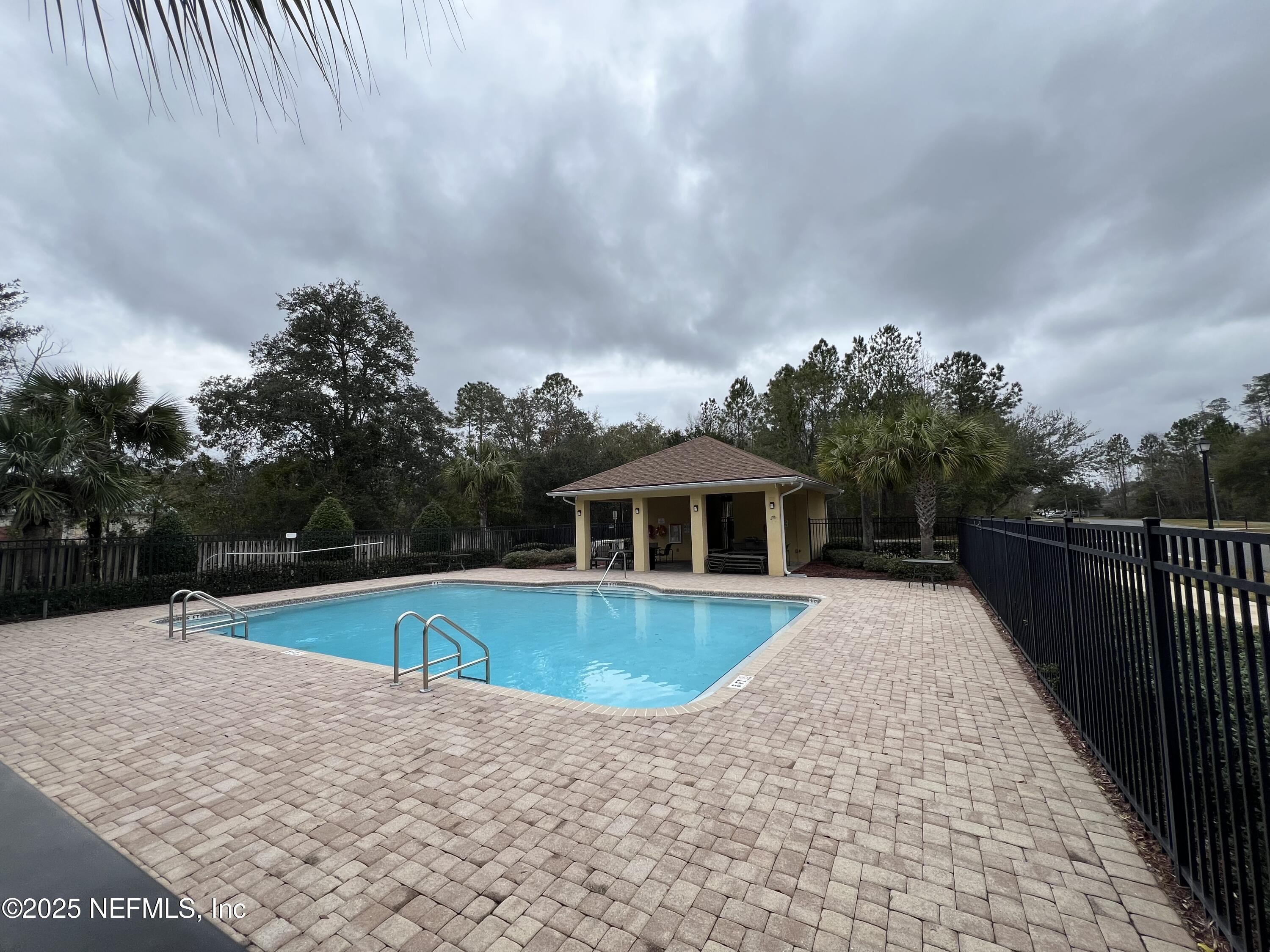 1960 McGirts Point Boulevard Jacksonville, FL 32221 - Photo 18 of 18 a view of a house with swimming pool