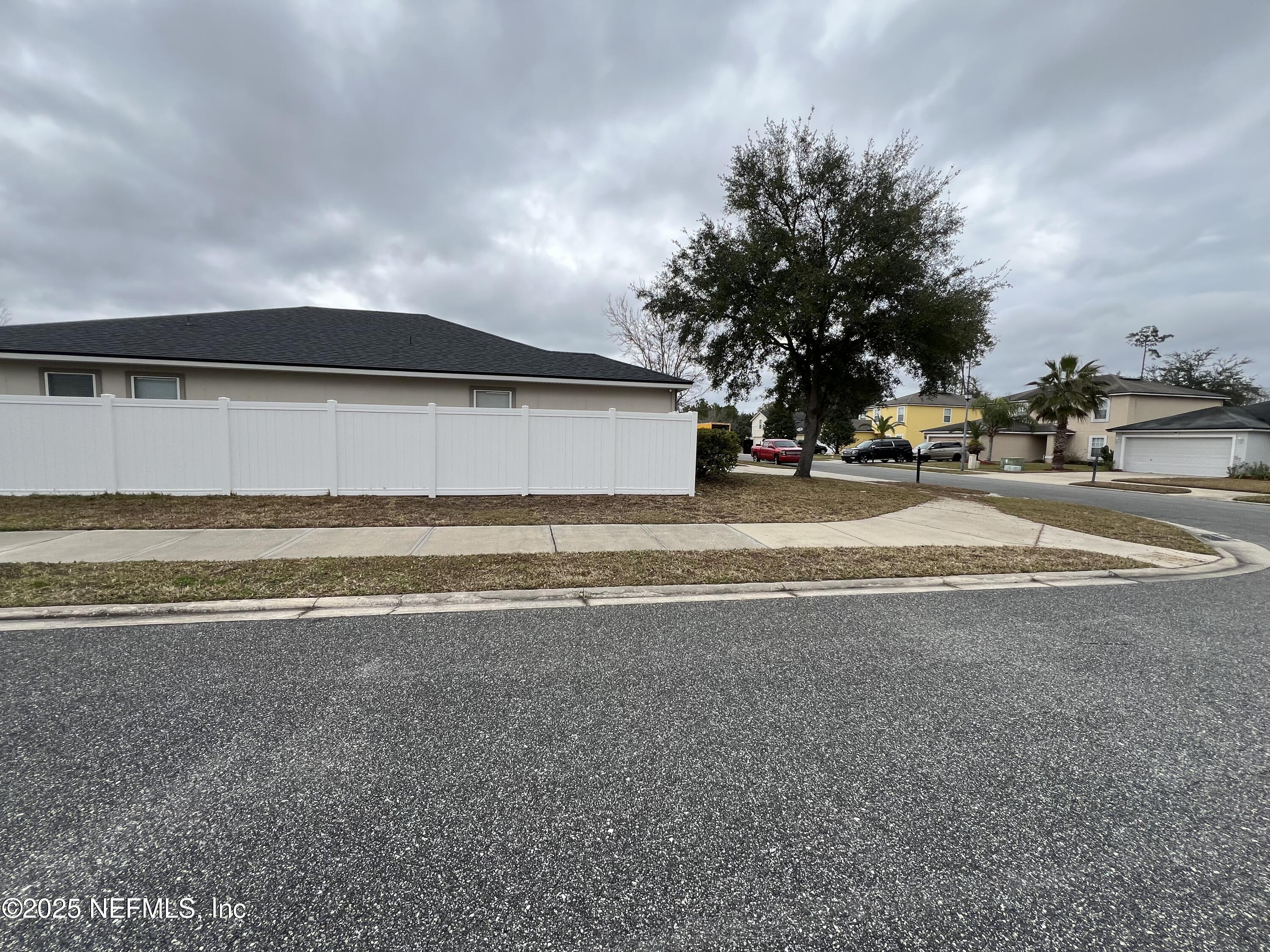 1960 McGirts Point Boulevard Jacksonville, FL 32221 - Photo 3 of 18 a view of a house with a yard