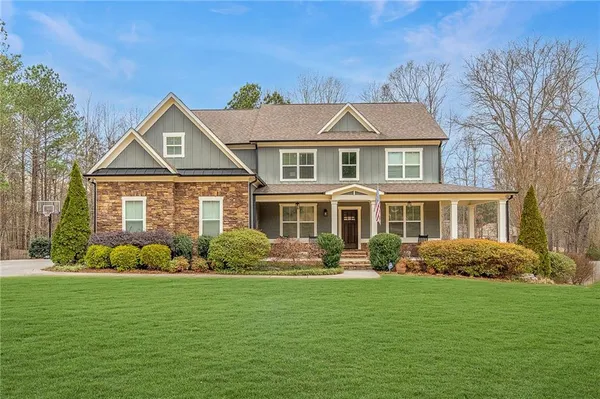 a front view of a house with a yard